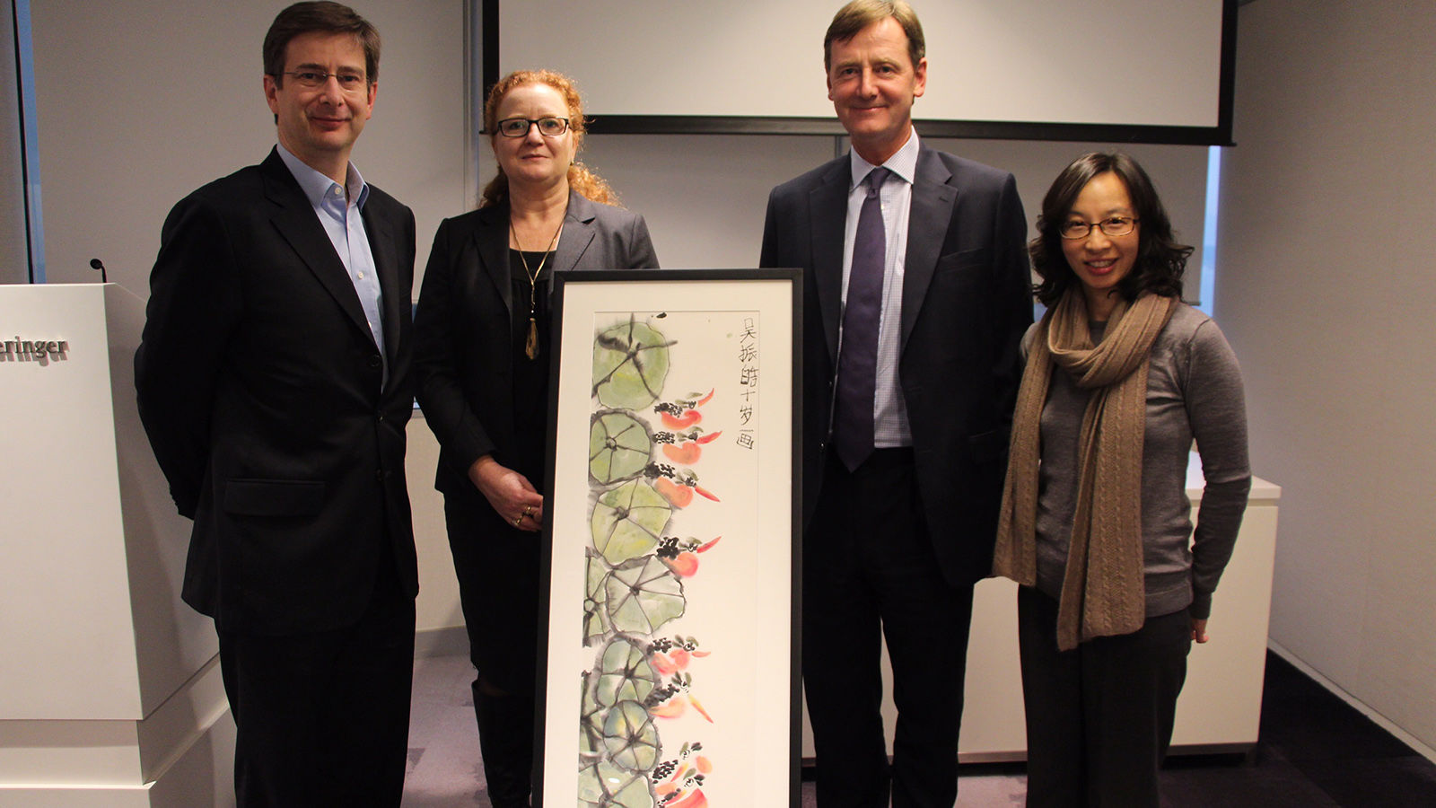 Freshfields Partner William Robinson and Asia Regional Managing Partner Robert Ashworth, along with OneSky's Chief Development Officer Natalie Campion, and Carmen Lau, Director of Development Asia celebrating Freshfields Bruckhaus Deringer’s 10-year support of OneSky’s work.